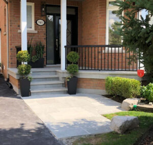 front entrance with exposed aggregate flooring