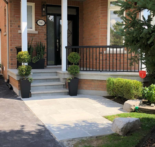 front entrance with exposed aggregate flooring