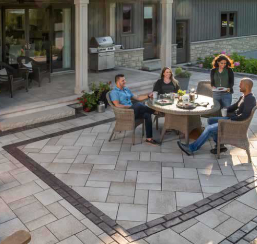 4 people in a rounded table on a beautiful patio