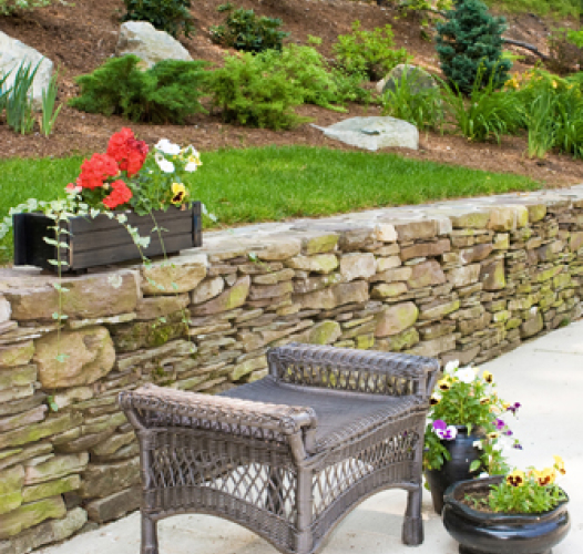 outdoor garden space with retaining wall